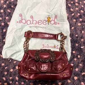 Brown purse by Babeed.